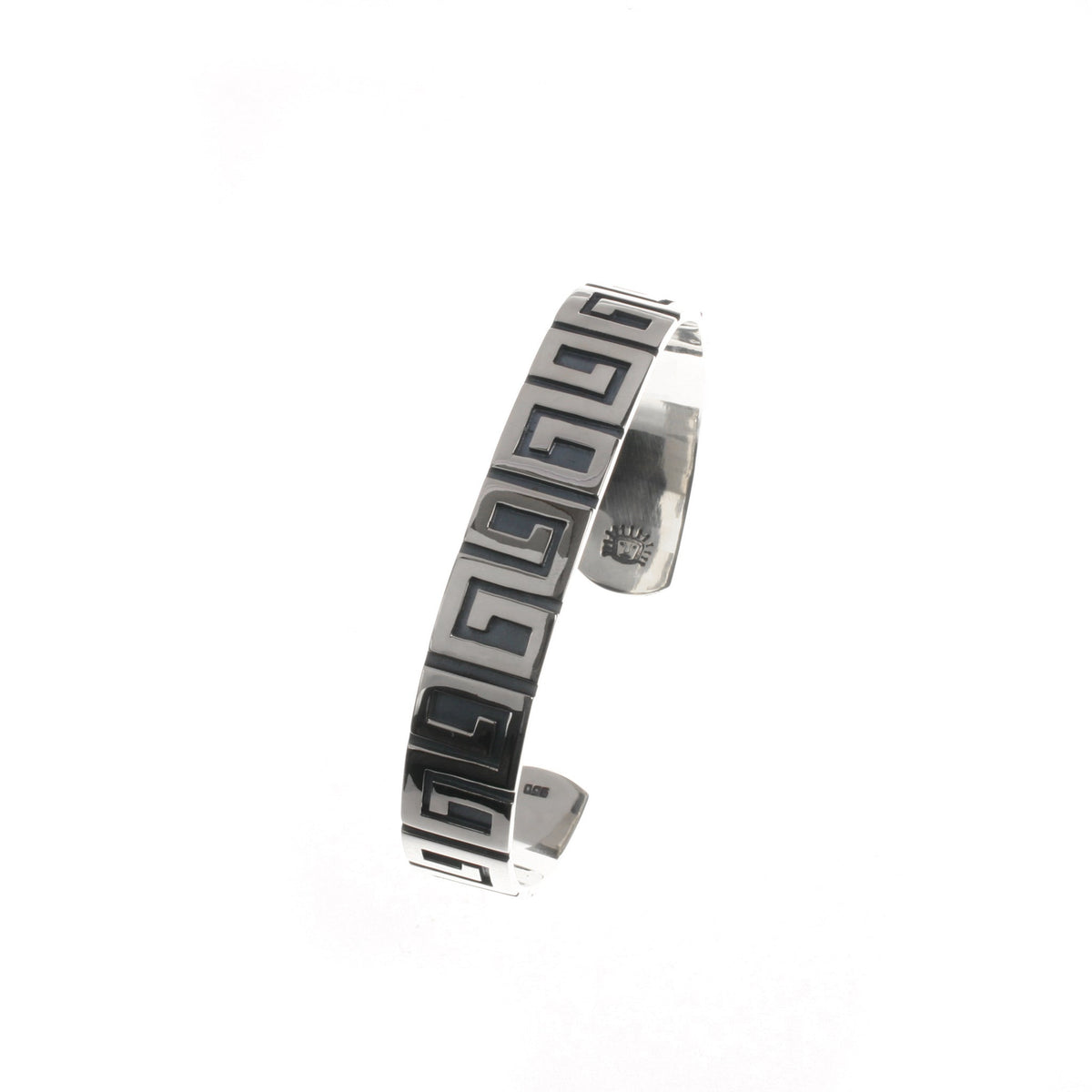Cuff bracelet with a visible brand logo on a white background