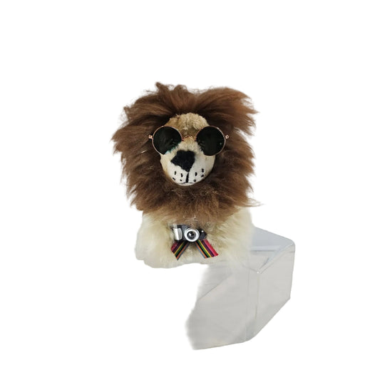 Stuffed lion toy with sunglasses and a bow tie on a white background